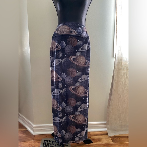 Light see through pencil stretchy skirt with planets on it. - Picture 1 of 3